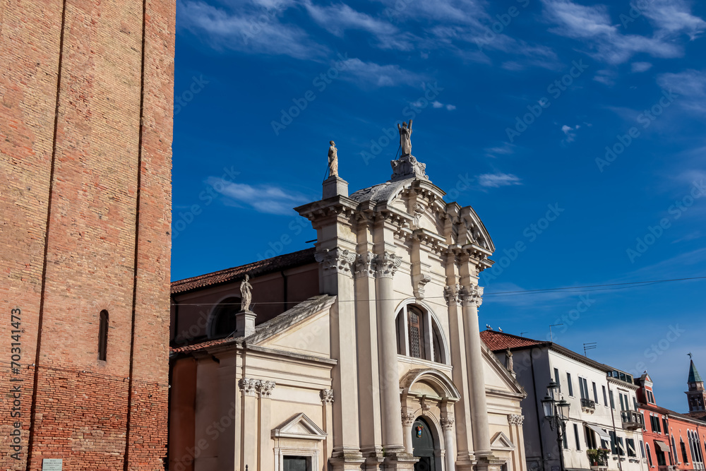 Obraz premium Close up view of majestic church Campanile di Sant'Andrea in charming town of Chioggia, Venetian Lagoon, Veneto, Italy. Tranquil atmosphere in summer. Historical landmark with Venetian architecture