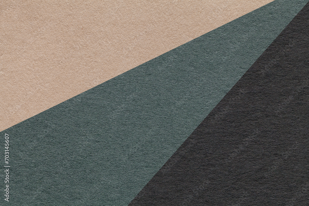 Fototapeta premium Texture of old craft beige, green and black color paper background, macro. Structure of vintage abstract cardboard