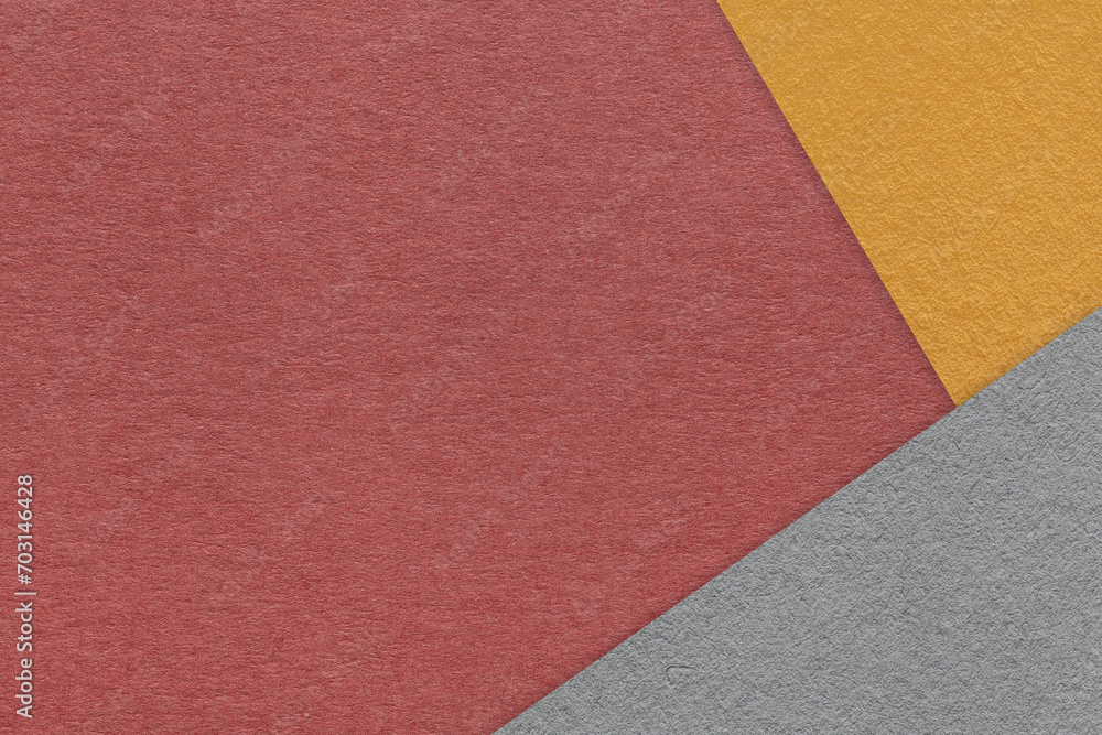 Texture of craft dark red color paper background with orange and gray border. Vintage abstract maroon cardboard. Texture of craft dark red color paper background with orange and gray border. Vintage abstract maroon cardboard.