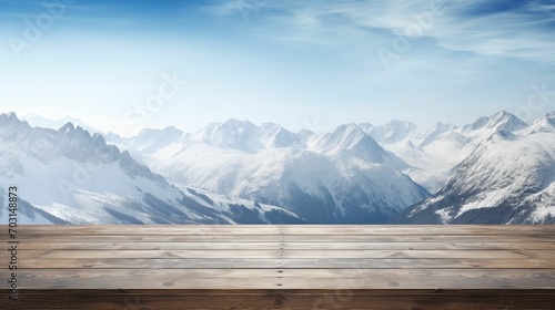 Snowy Alps in the background, set against an empty wooden table. © kept