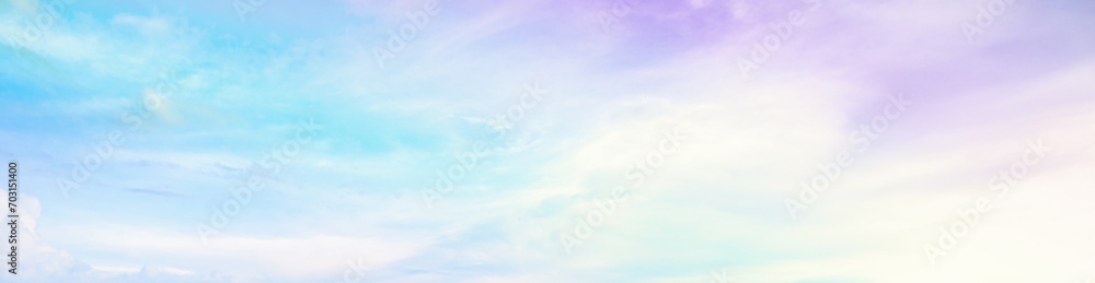 Beautiful rainbow pastel color with clouds and blue sky