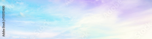 Beautiful rainbow pastel color with clouds and blue sky