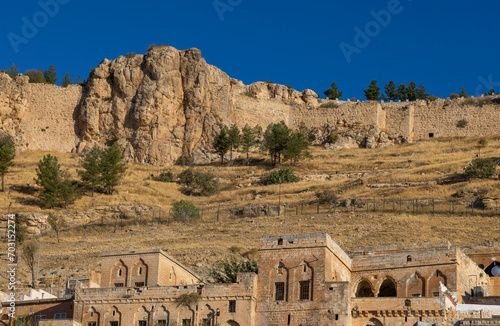 Ancient and stone houses of Old Mardin (Eski Mardin) with Mardin Castle, Located South Eastern of Turkey photo