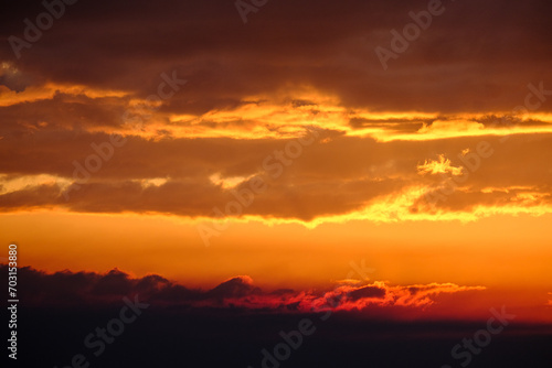 Panoramic sunrise or sunset landscape nature coastal scenery with beautiful fire sky and dramatic cloudscapes in Alaska Inside Passage glacier mountain range view © Tamme