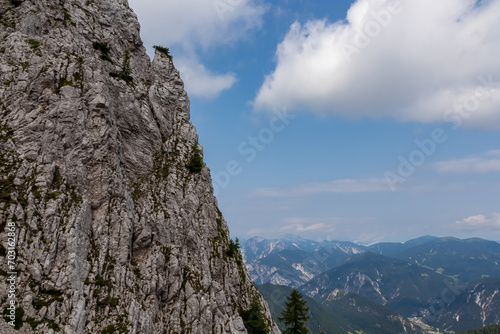 Scenic hiking trail to mountain peak Cima del Cacciatore in remote Julian Alps, Friuli-Venezia Giulia, Italy. Trailhead from Monte Santo di Lussari, Camporosso. Wanderlust in untamed Italian Alps photo