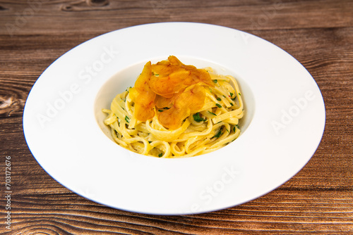 LINGUINE PASTA RECIPE WITH POUTARGUE, LEMON, GARLIC, LEMON ZEST, FRESH CREAM AND PARSLEY. High quality photo photo