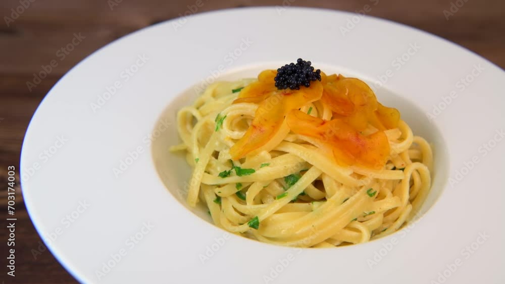 LINGUINE PASTA RECIPE WITH POUTARGUE, LEMON, GARLIC, LEMON ZEST, FRESH CREAM AND PARSLEY. High quality 4k footage LINGUINE PASTA RECIPE WITH POUTARGUE, LEMON, GARLIC, LEMON ZEST, FRESH CREAM AND PARSLEY. High quality 4k footage