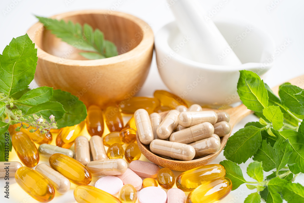 Alternative medicine herbal organic capsule with vitamin E omega 3 fish oil, mineral, drug with herbs leaf natural supplements for healthy good life. Alternative medicine herbal organic capsule with vitamin E omega 3 fish oil, mineral, drug with herbs leaf natural supplements for healthy good life.