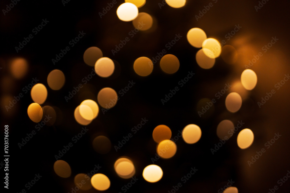 Golden bokeh lights for Christmas Eve at night Golden bokeh lights for Christmas Eve at night