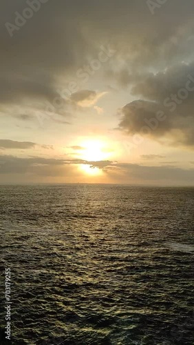 The Ocean's Symphony: A Video of the Stunning Sunset Scenery photo