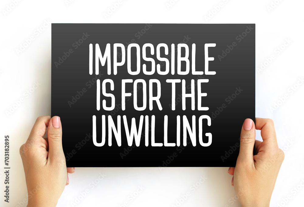 Impossible is for the Unwilling text quote on card, concept background Impossible is for the Unwilling text quote on card, concept background