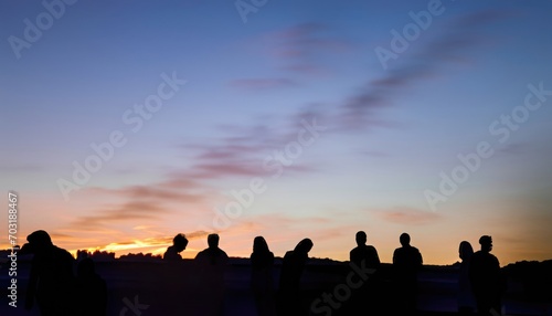 Long exposure to twilight sky and people s silhouette