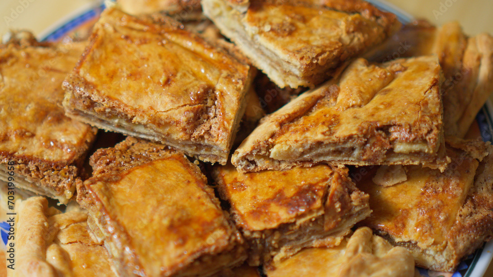 Honey baklava with nuts lies on plate Honey baklava with nuts lies on plate
