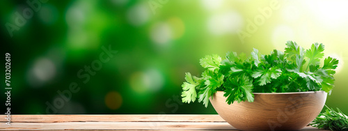 Cilantro in a bowl against the backdrop of the garden. Selective focus.