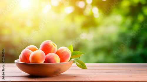 Peaches in a bowl in the garden. Selective focus.