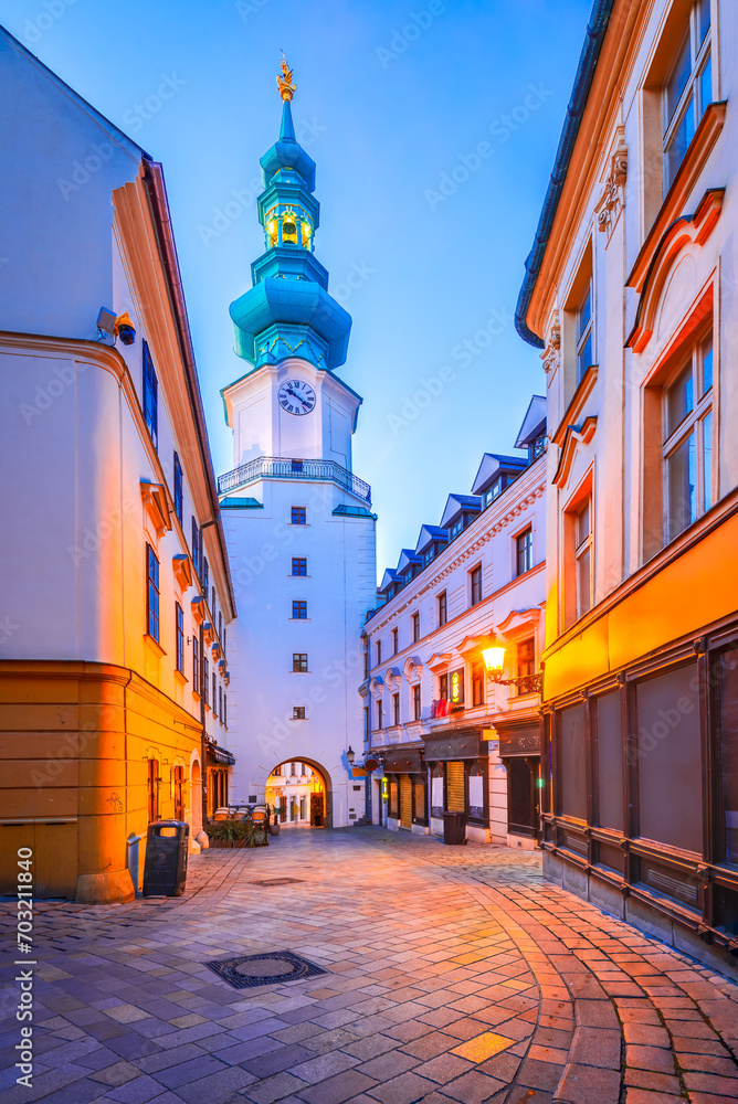 Bratislava, Slovakia. A street in the Old Town leading to Michael's Gate tower. - obrazy, fototapety, plakaty 