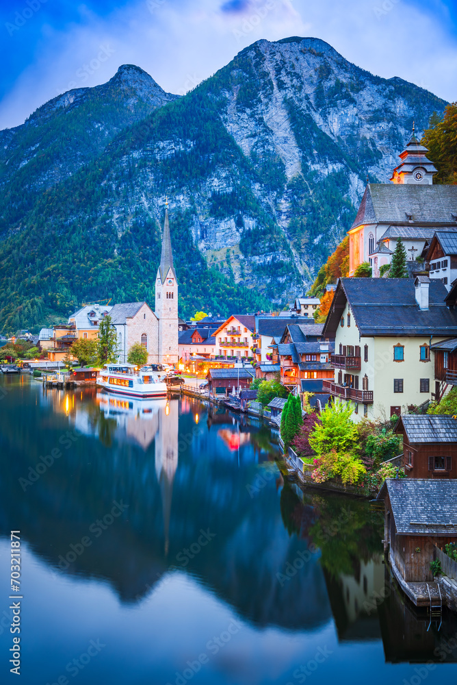 Hallstatt, Austria. Small village, misty scenic landscape twilight hour, Austrian Alps.