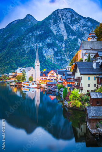 Obraz na płótnie Hallstatt, Austria. Small village, misty scenic landscape twilight hour, Austrian Alps. w salonie