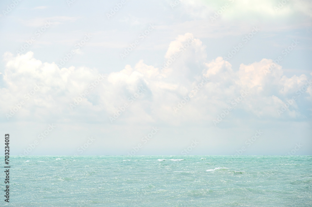 A tropical sea, and a cloudy sky on a bright, summers day.  The view is from Key West, the southernmost point of the continental USA 