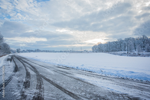 Road in winter landscape in Hassleholm, Sweden © StellaSalander