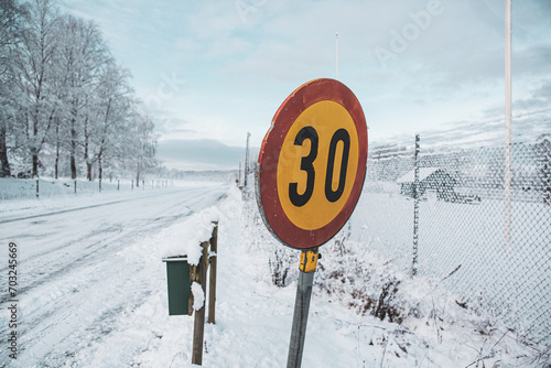 Winter road where the maximum speed is 30 kilometers per hour in Hassleholm, Sweden photo