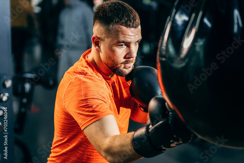 Attractive men boxer training in gym
