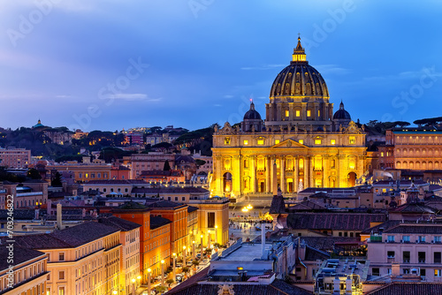Saint Peter Basilica in Vatican City at Rome, Italy and Street Via della Conciliazione at sunset sky. photo
