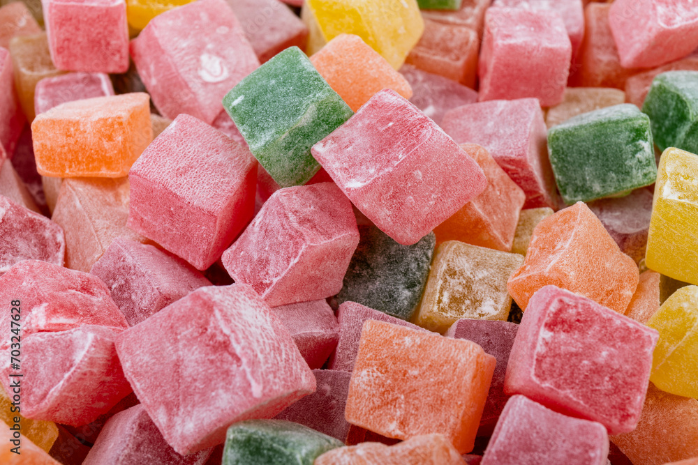 Closeup of multicolored cubes Turkish delight (Lokum). Selective Focus. Flat lay. Closeup of multicolored cubes Turkish delight (Lokum). Selective Focus. Flat lay.
