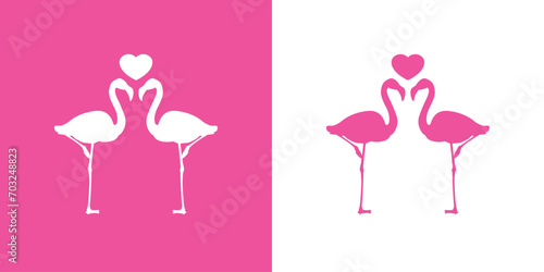 Silueta de dos flamingos de pie con corazón entre sus largos cuellos. Icono romántico. Logo para su uso en felicitaciones y tarjetas de San Valentín photo