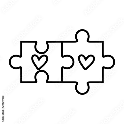 Logo del día de San Valentín. Silueta de piezas de puzzle lineal con dos corazones para su uso en felicitaciones y tarjetas