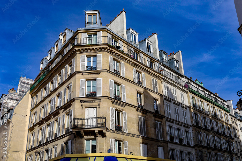 typical parisians building facade , haussmannian style  4th arrondissement