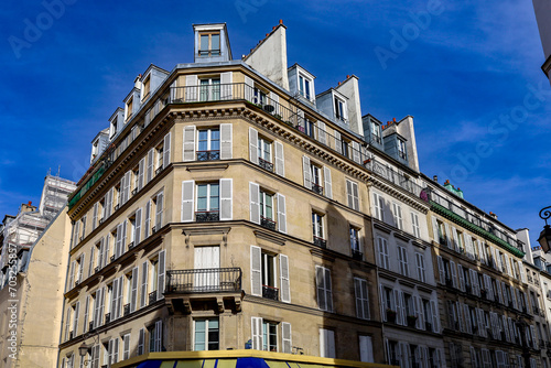typical parisians building facade , haussmannian style 4th arrondissement