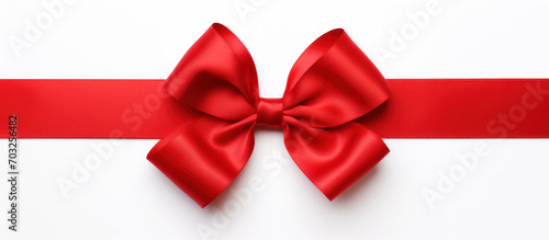 red ribbon and bow on a white background. Wedding card invitation decoration