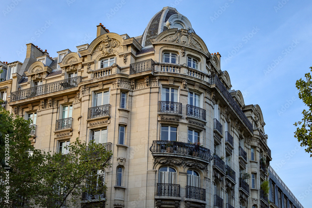 typical parisians building facade , haussmannian style  15th arrondissement