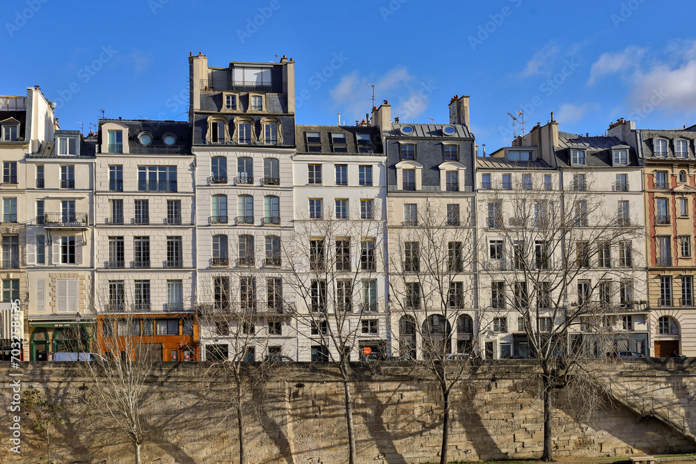 typical parisians building facade , haussmannian style  , Seine river embankments