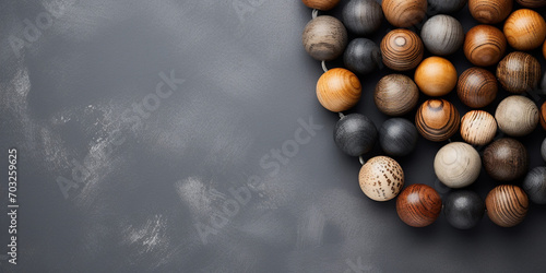 Wooden Beads: Overhead View on Gray Backdrop,,
Elegant Gray Backdrop with Wooden Beads Arrangement