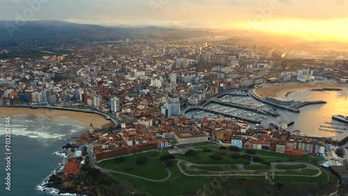 Drone point of view Gijon or Xixon city in north-western Spain during sunset, coast of Cantabrian Se, Bay of Biscay, in the central-northern part of Asturias. Travel destinations, landmarks concept photo