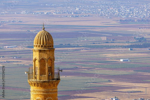 Ancient and stone houses of Old Mardin (Eski Mardin) with Mardin Castle, Located South Eastern of Turkey photo