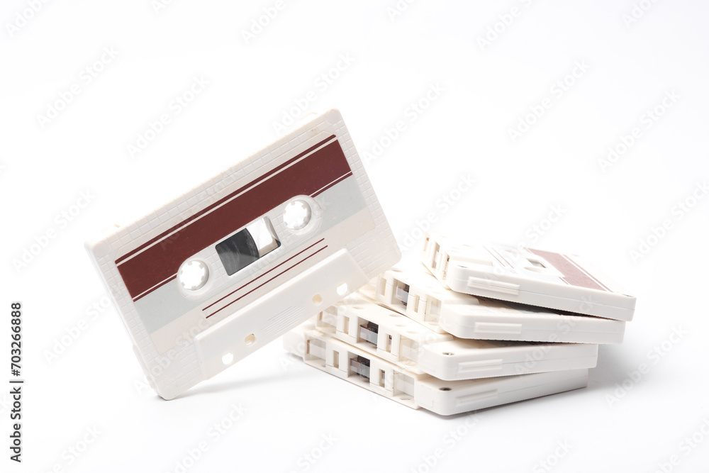 Stack of retro 80s audio cassettes on white background Stack of retro 80s audio cassettes on white background