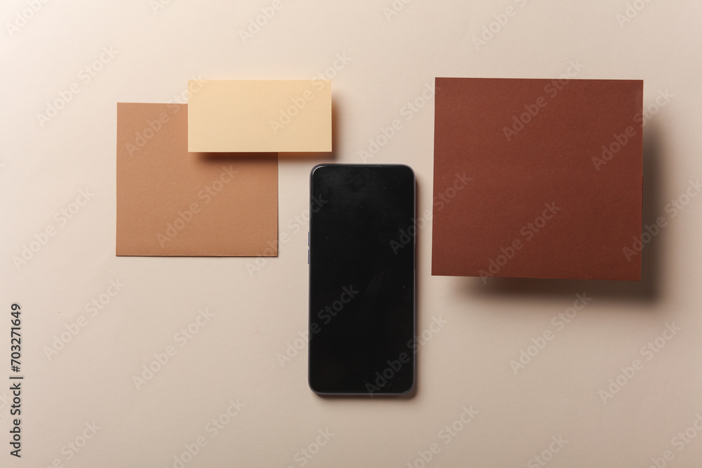 Smartphone and Set of floating blank card sheets with shadow on beige background. Minimalism business brand template, creative layout Smartphone and Set of floating blank card sheets with shadow on beige background. Minimalism business brand template, creative layout