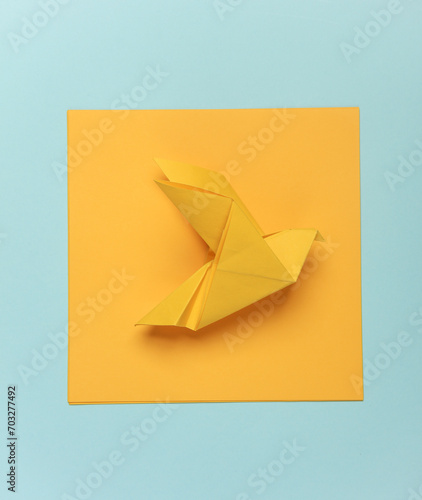 Free Download Yellow origami dove on a blue background - GFXLoad
