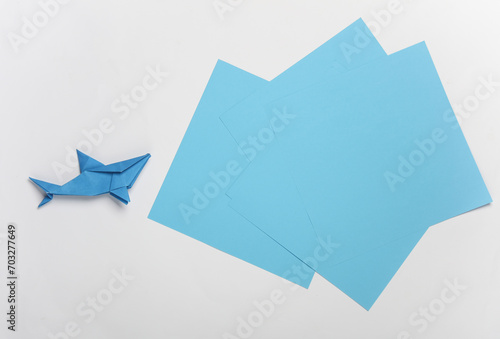Blue paper shark on white background
