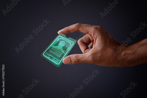 Billede på lærred Closeup image of hand and digital identification card or digital ID on black background