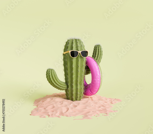 3d rendering of a green cactus sporting cool sunglasses and a pink swim ring, placed on beach sand surface against a light green studio background. Minmalist summer concept. photo