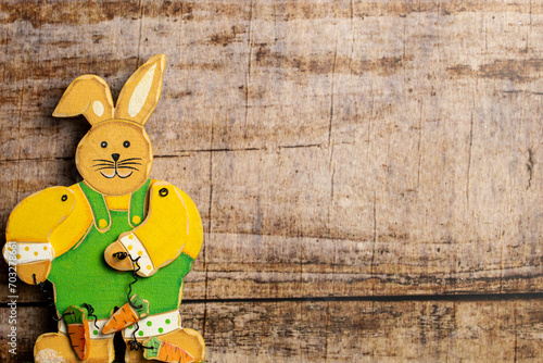Easter Bunny on wooden background with copy space © SLindenau
