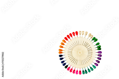 Sewing needles. A spool of colored sewing threads for tailors. On a white isolated background. used by factories in the garment industry.