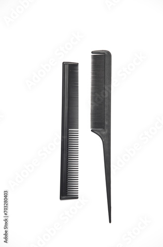 Black plastic combs for haircuts on a white background