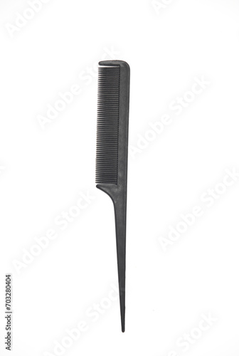 Black plastic comb for haircuts on a white background