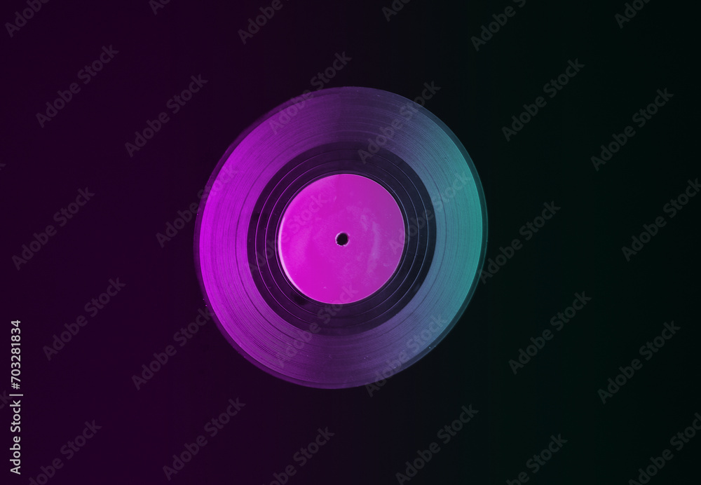 Vinyl record isolated on black background in neon light Vinyl record isolated on black background in neon light