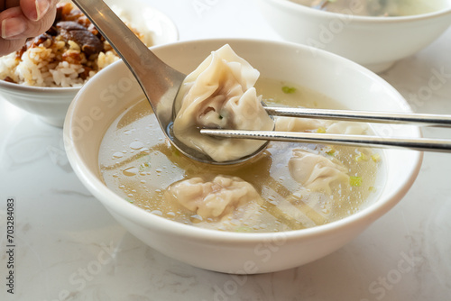 Wonton dumpling soup, distinctive and famous cuisine of Taiwanese food. photo